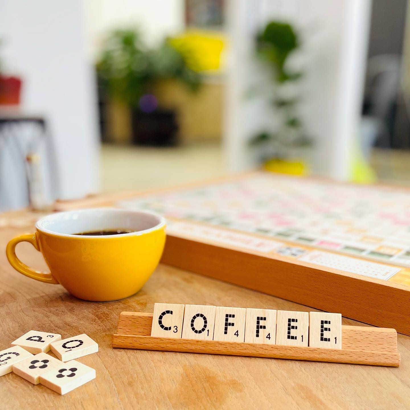 Cup of coffee and scrabble game in the Flower and Coffee Shop